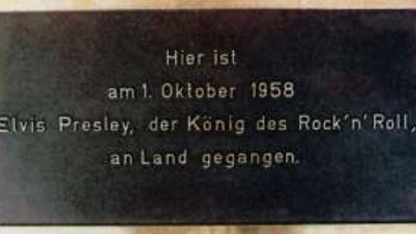A metal plate with inscription.