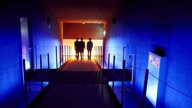 People go through a dark corridor