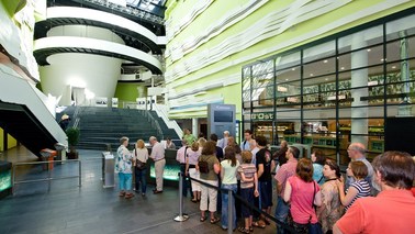 Visitors stand in the entrance area of the Climate House