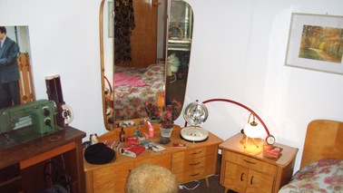 Vanity with table and mirror.