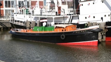A motor tug in the harbor.