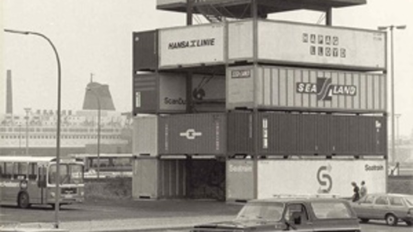 Black and white photograph of a container tower.
