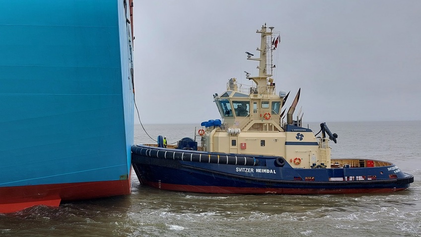 A tugboat pulling a ship 