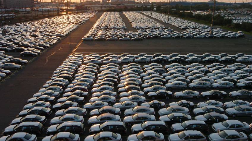 Many cars are in rows.