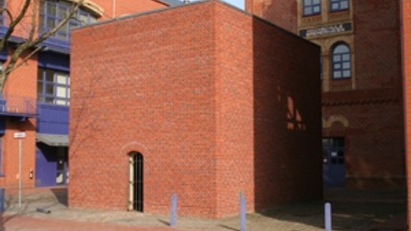 A square building in brick.