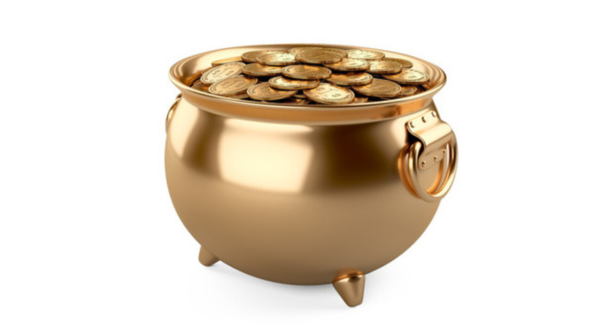 Ein großer goldglänzender Kessel mit Münzen