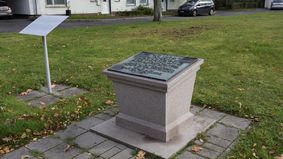 A monument with a plaque.