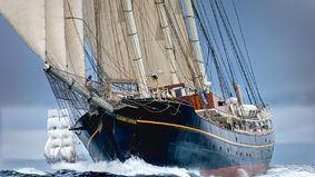 A topsail schooner at full speed.