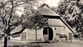 Historical image of a farmhouse.