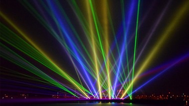 Colorful lasers in the sky at night