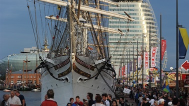 Sailing ship, crowds and in the background the Atlantic Hotel Sail City