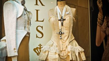 Decorated shop window with a dress and a suit.