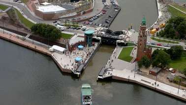 Aerial view of a lock, a ship moves toward the lock.
