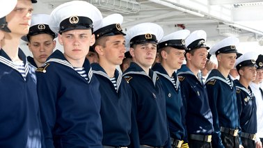 Young crew members stand side by side