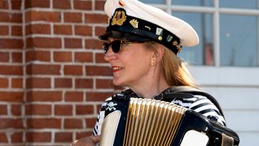 Woman plays the accordion